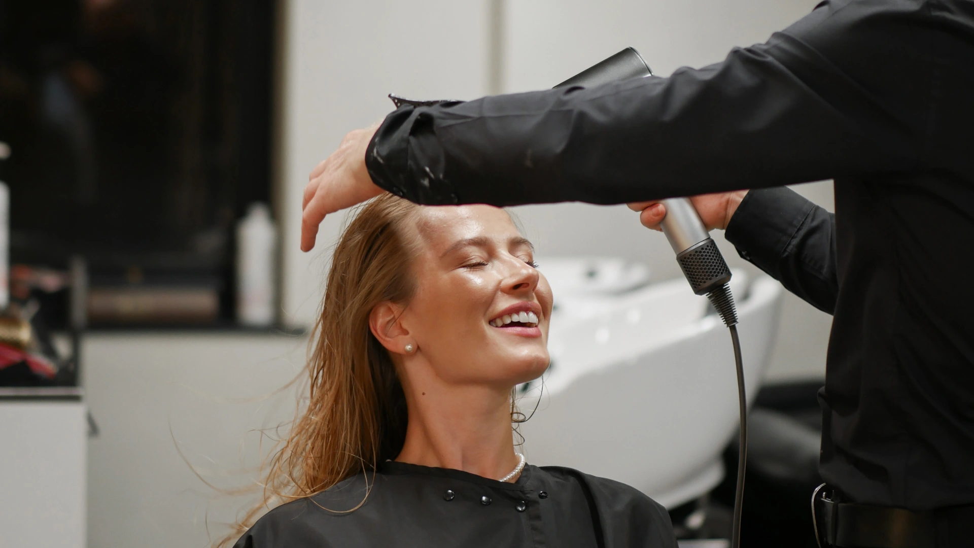 Professional Hair color transition from black for a refreshed look.